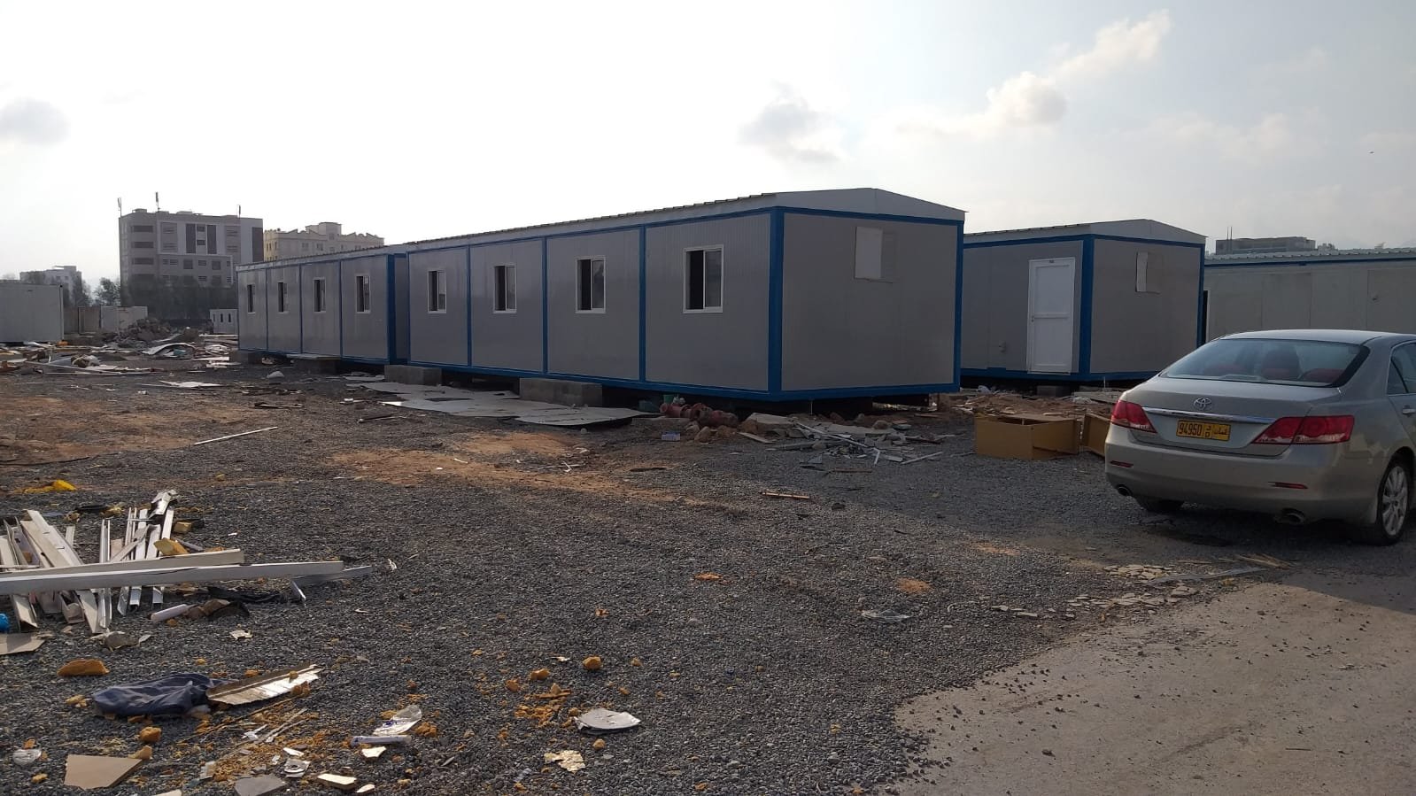 Long block of joined porta cabins installed on a project site