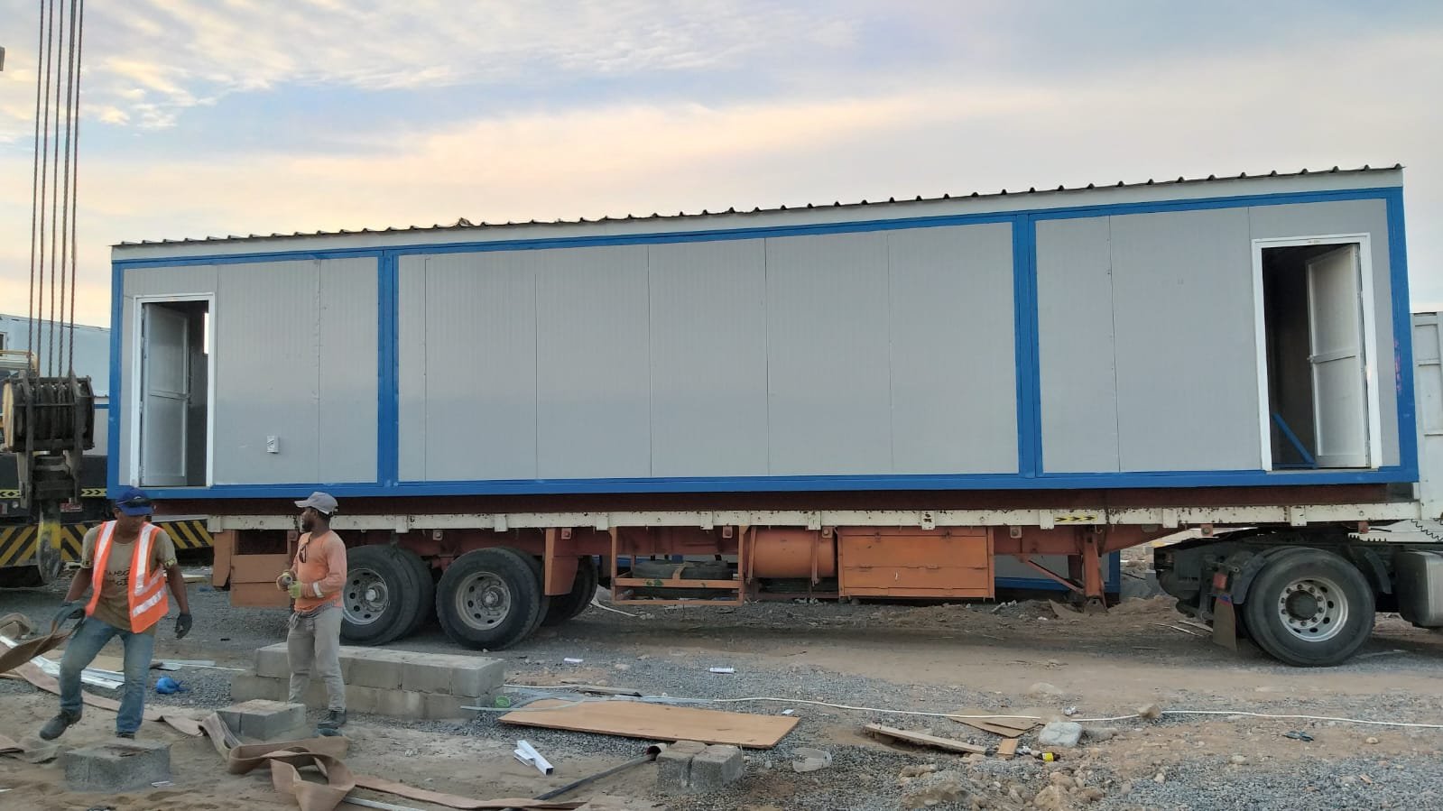 Sandwich panel cabin loaded on a trailer for delivery